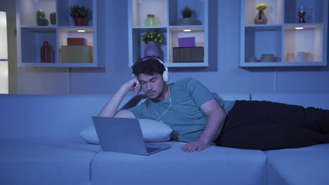 Man-watching-movie-on-laptop-at-night.